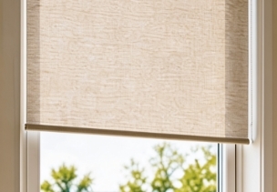 Conventional textile interior roller blind at the window