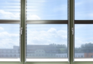 Window with interior sun protection and a clear view outside