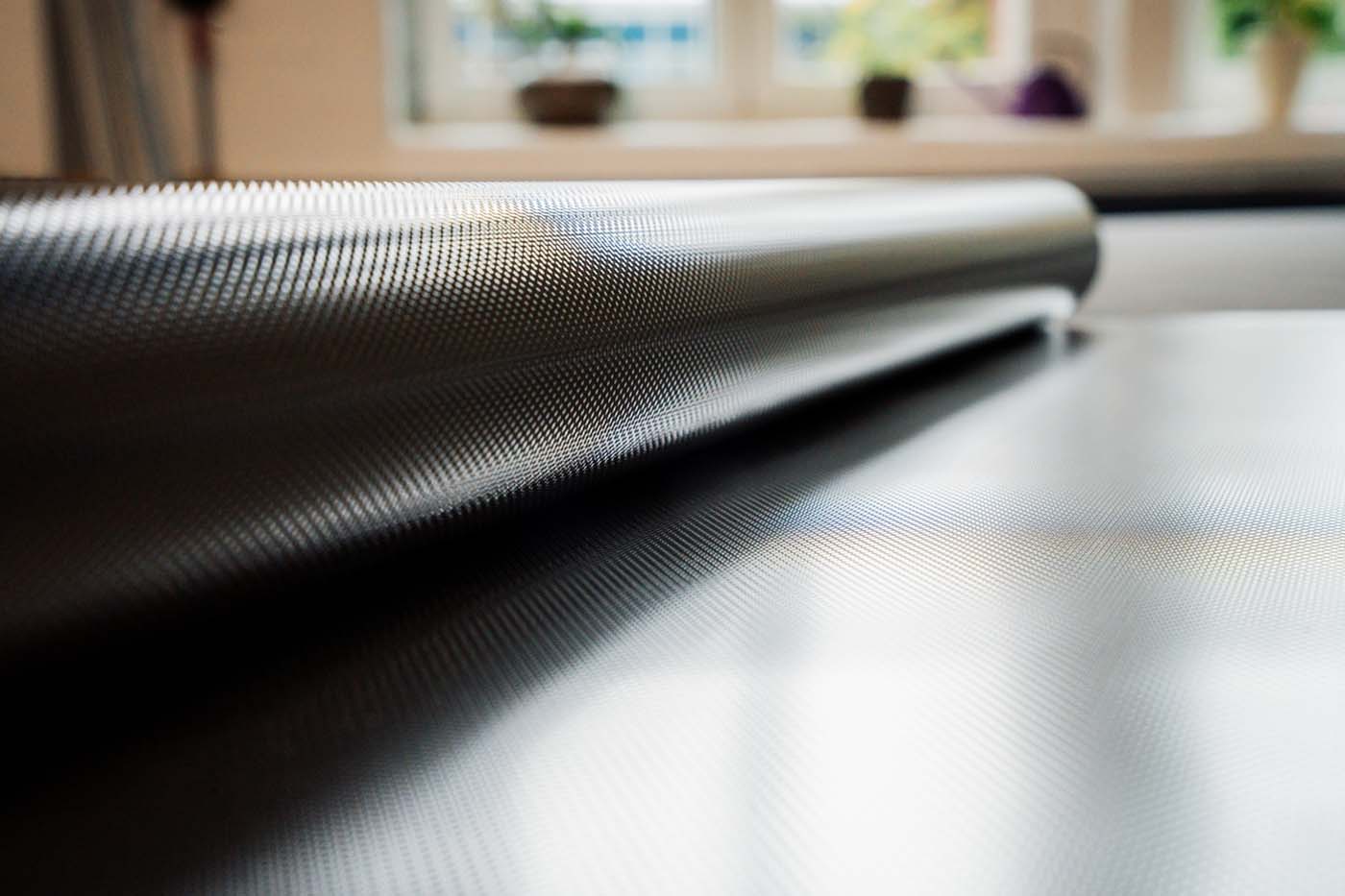 Close-up of a film roll with a shiny metallic surface